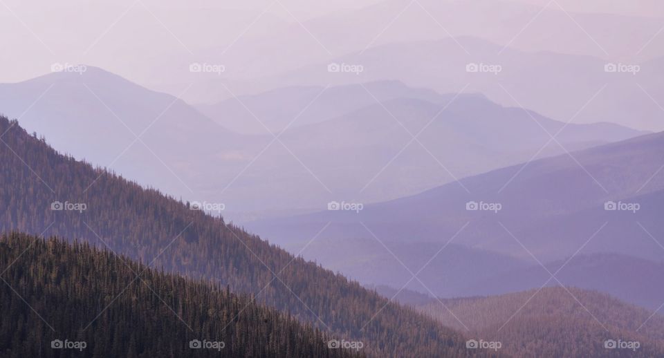 Layers and layers of purple mountains are created by dense wildfire smoke in Colorado.