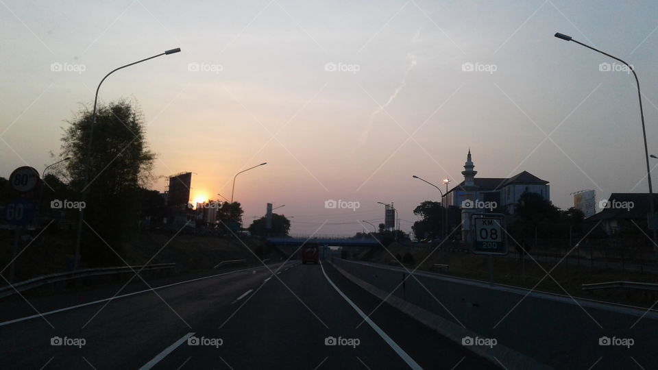 see the sun set while on the highway 2