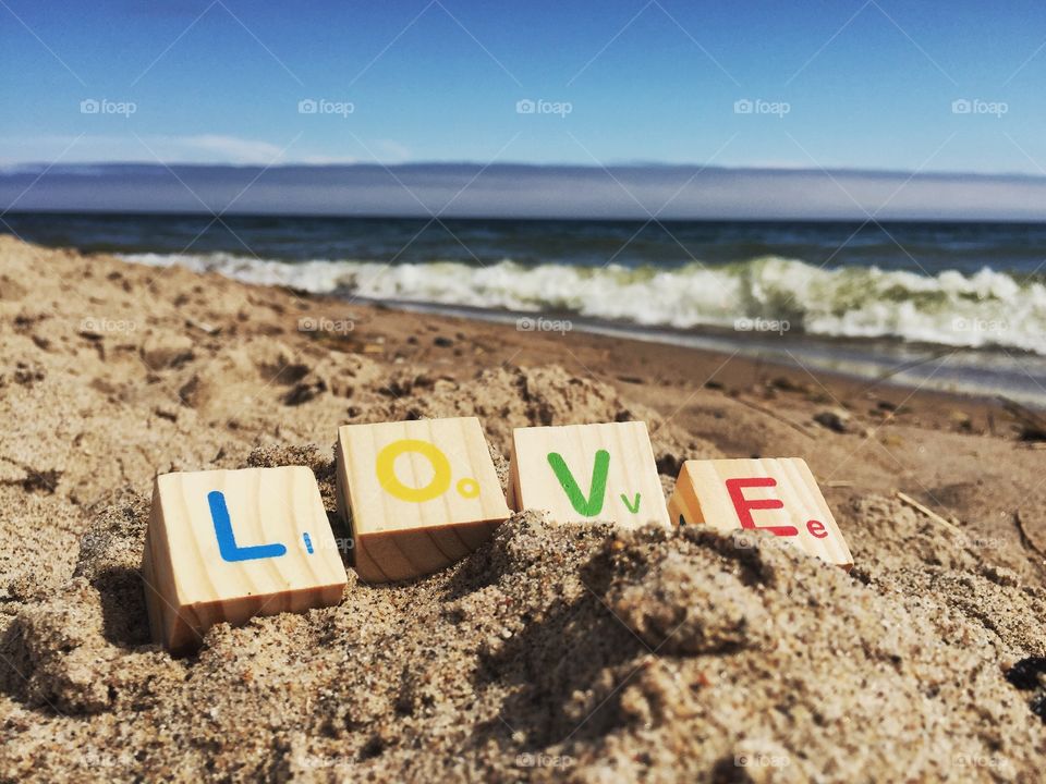 Love text at beach