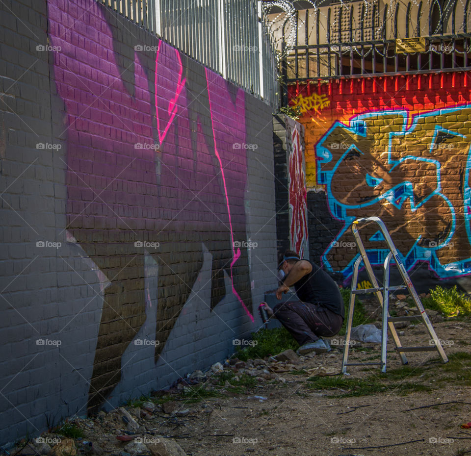 A talented street artist concentrating on his craft