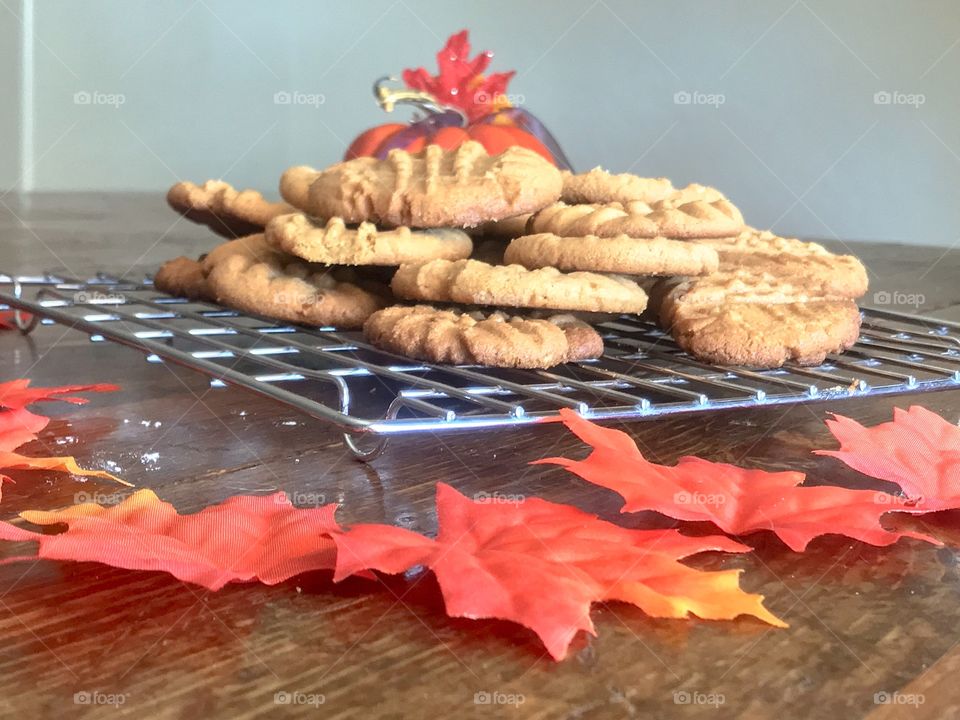 Golden Peanut Butter Cookies on Cooling rack with Maple Leaves and pumpkin 