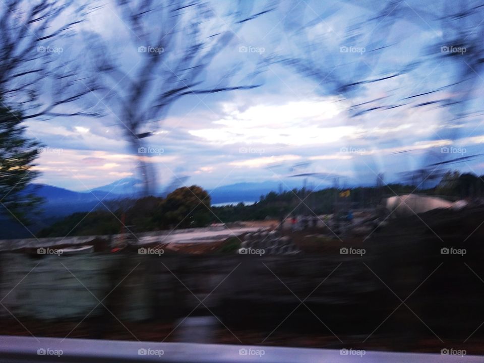 blurry view of taal lake volcano from a jeepney