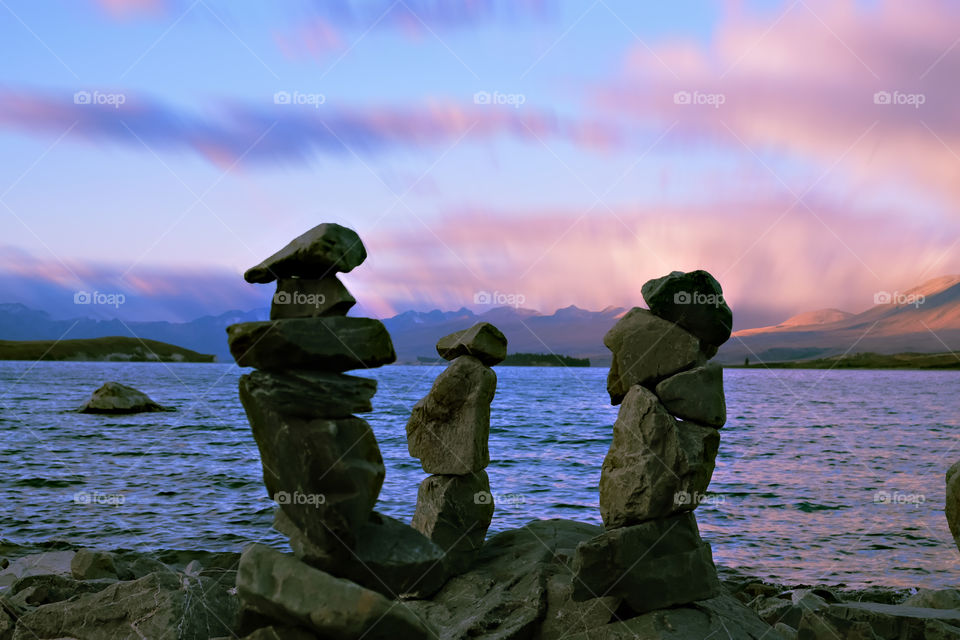 Three tourists by the lake.