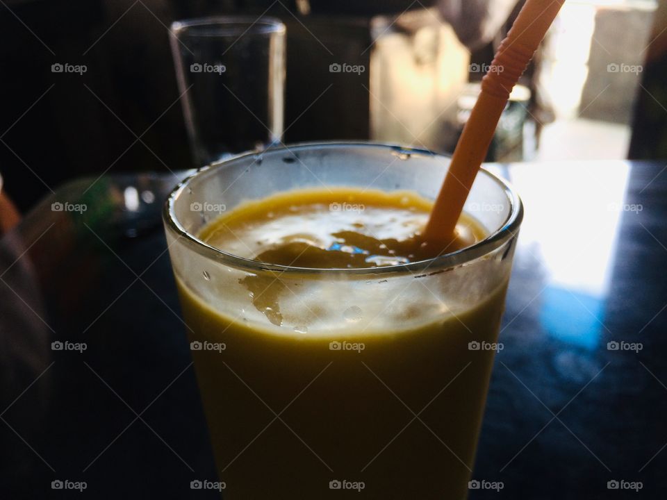 Mango juice and straw landscape