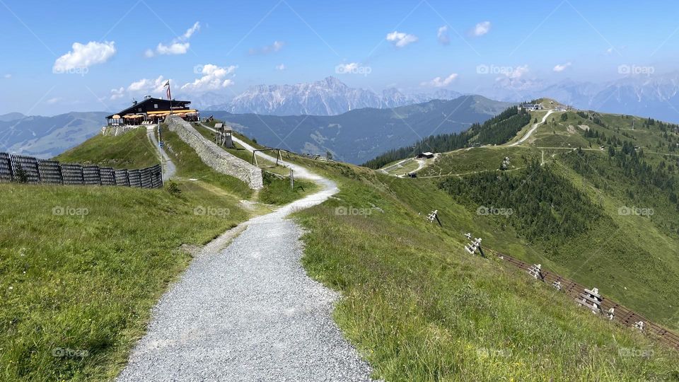 Hiking trail in the beautiful landscape of Schmitten Austria, view of mountain peaks, perfect place to go hiking in 