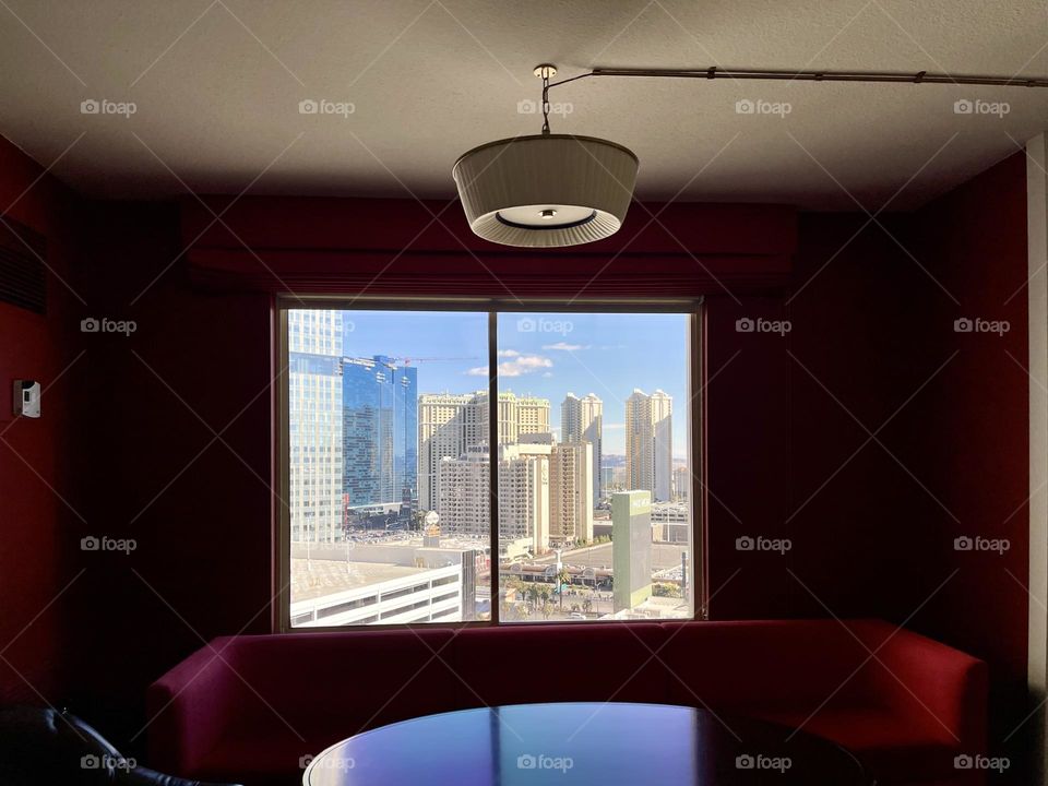 Room with window and cityscape 