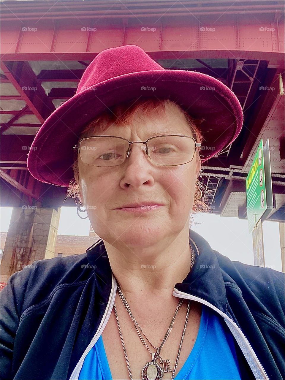I, „Petra Schiller“ a.k.a. „Maximiliane Feuerfuchs“ am standing underneath the „Pulaski Bridge“ at „Newtown Creek“ in LIC, Queens on a slightly overcast day in August of 2023. Hypnotic Productions