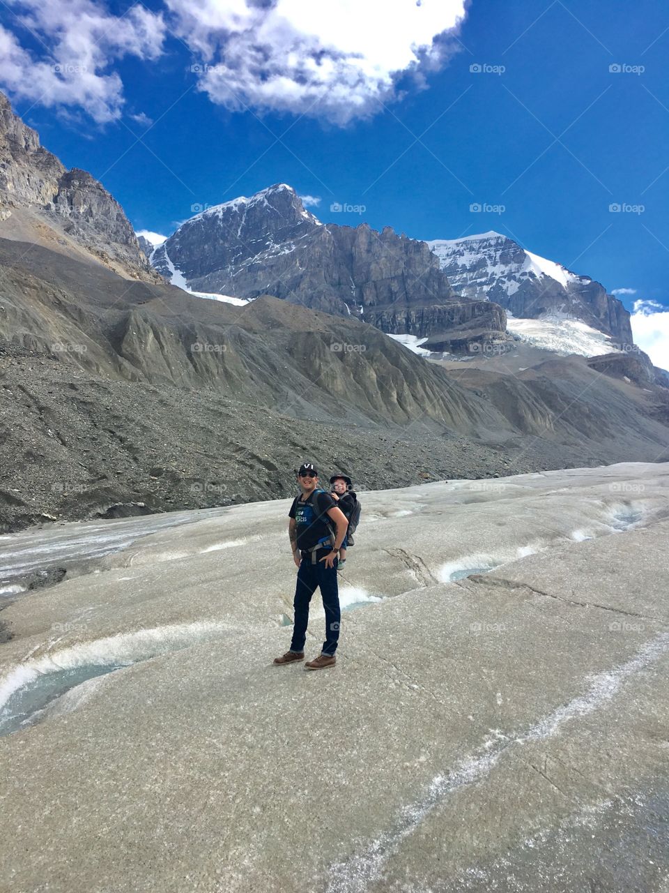 Father and son on a glacier in Alberta 