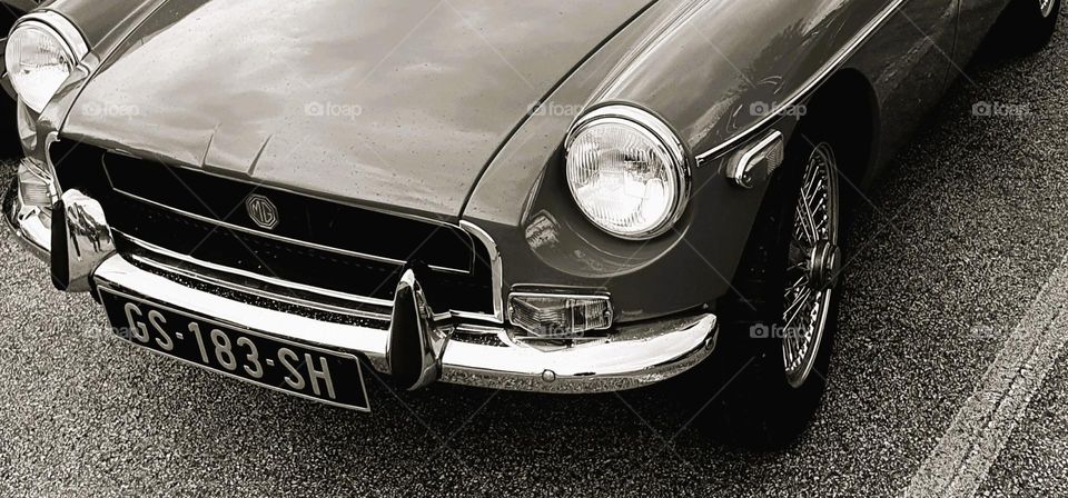 Sepia shot of the front of an MG at Cherbourg car show