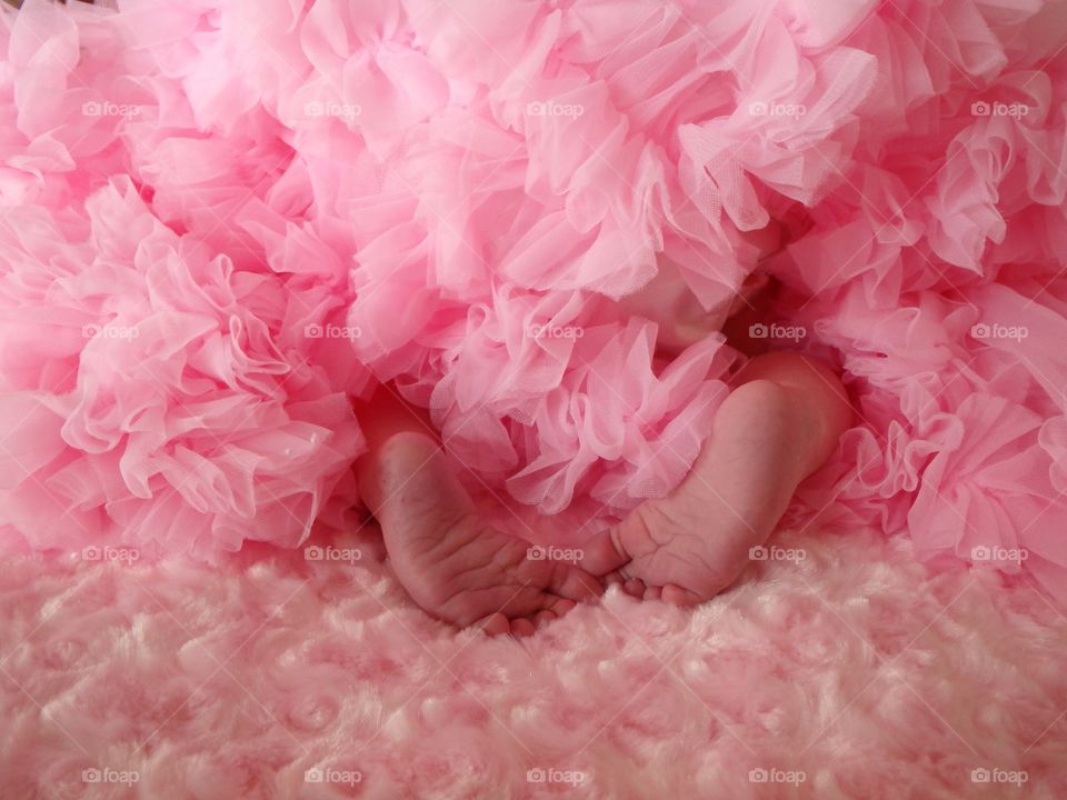 Pink tutu and baby feet