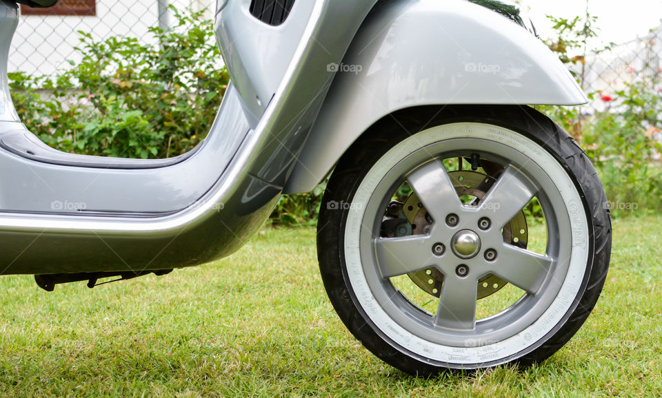 grey vespa motorcycle wheel, italian style