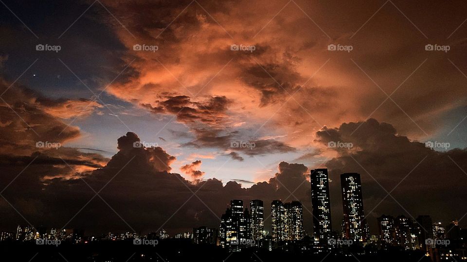 Clouds of Circus decorating the dusky city sky being changing colours and shape....flying here and there.