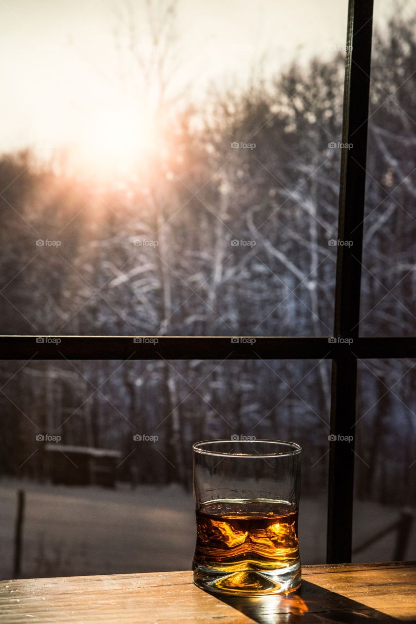Whiskey on a table winter outside