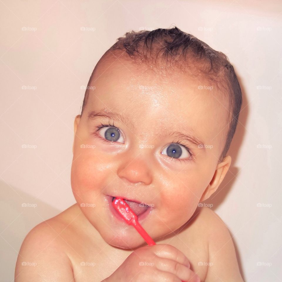 Baby boy brushing teeth