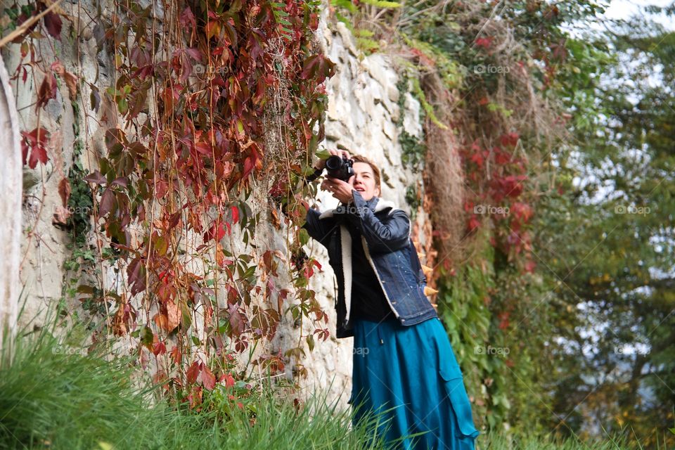 Portrait of a woman photographing