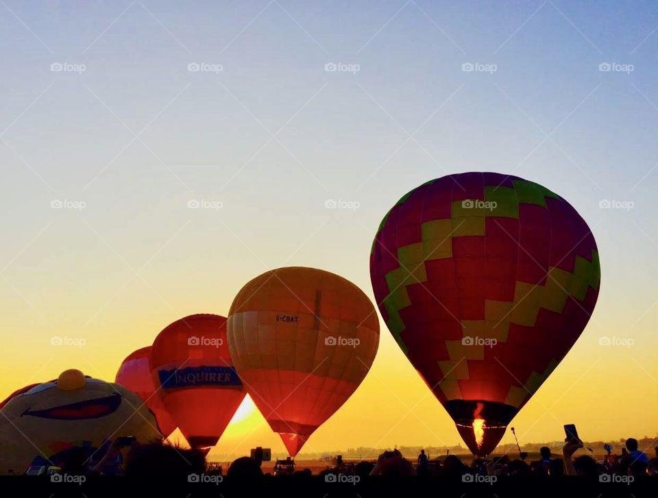 Hot air balloon show during sunrise