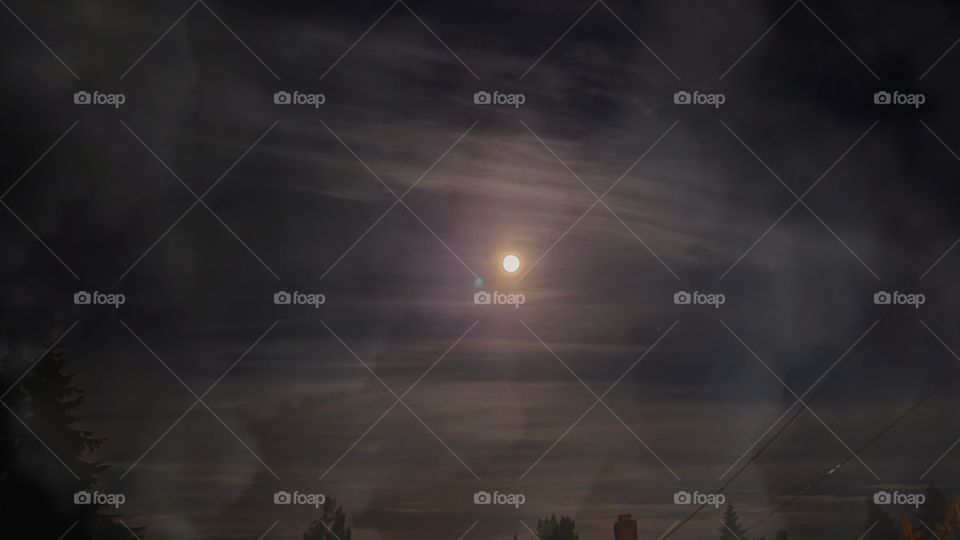 A smokey full moon night looks magical & mystical