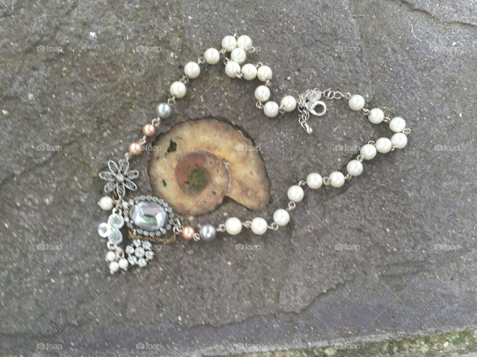 Taken at the beautiful Blanton House in Danville, IN. Pearl necklace  with a shell encased in concrete. 