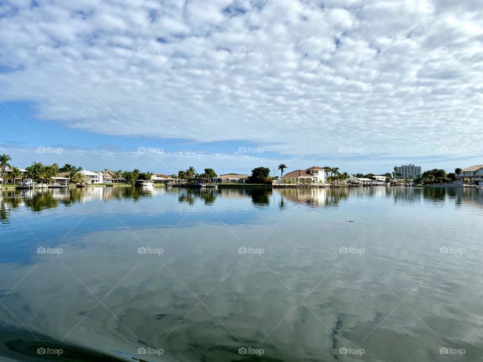 Clouds and reflections in a calm body of water