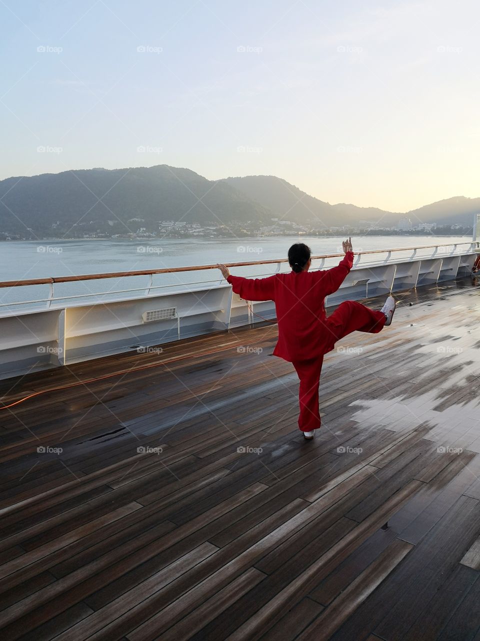 Chinese lady engages in oriental Tai chi art