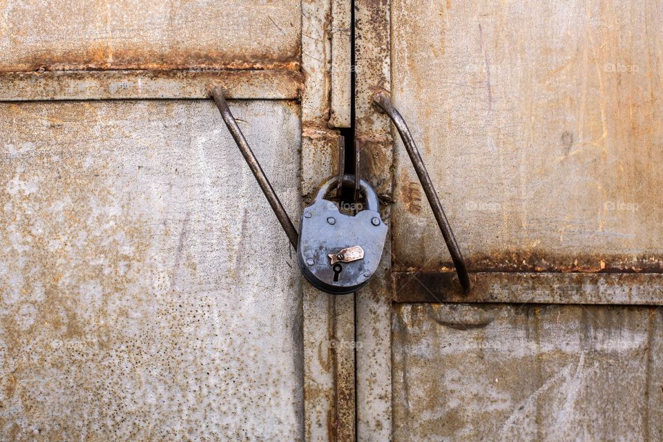 Old lock on rusty door