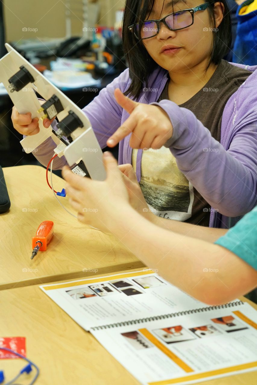 Girls Engineering A Circuitboard