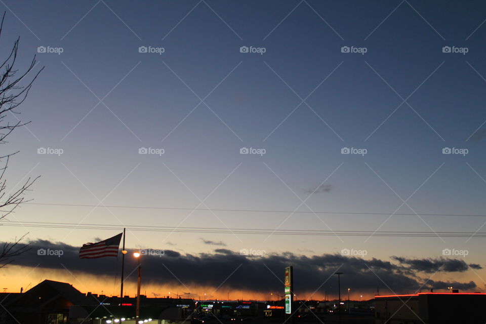 Beautiful sunset in Nebraska with an American flag 