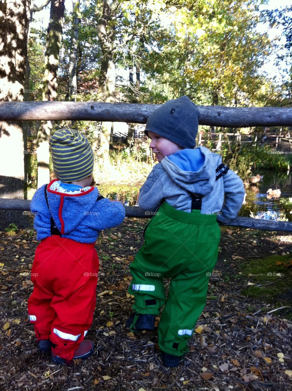 Two small boys in colorful clothes 