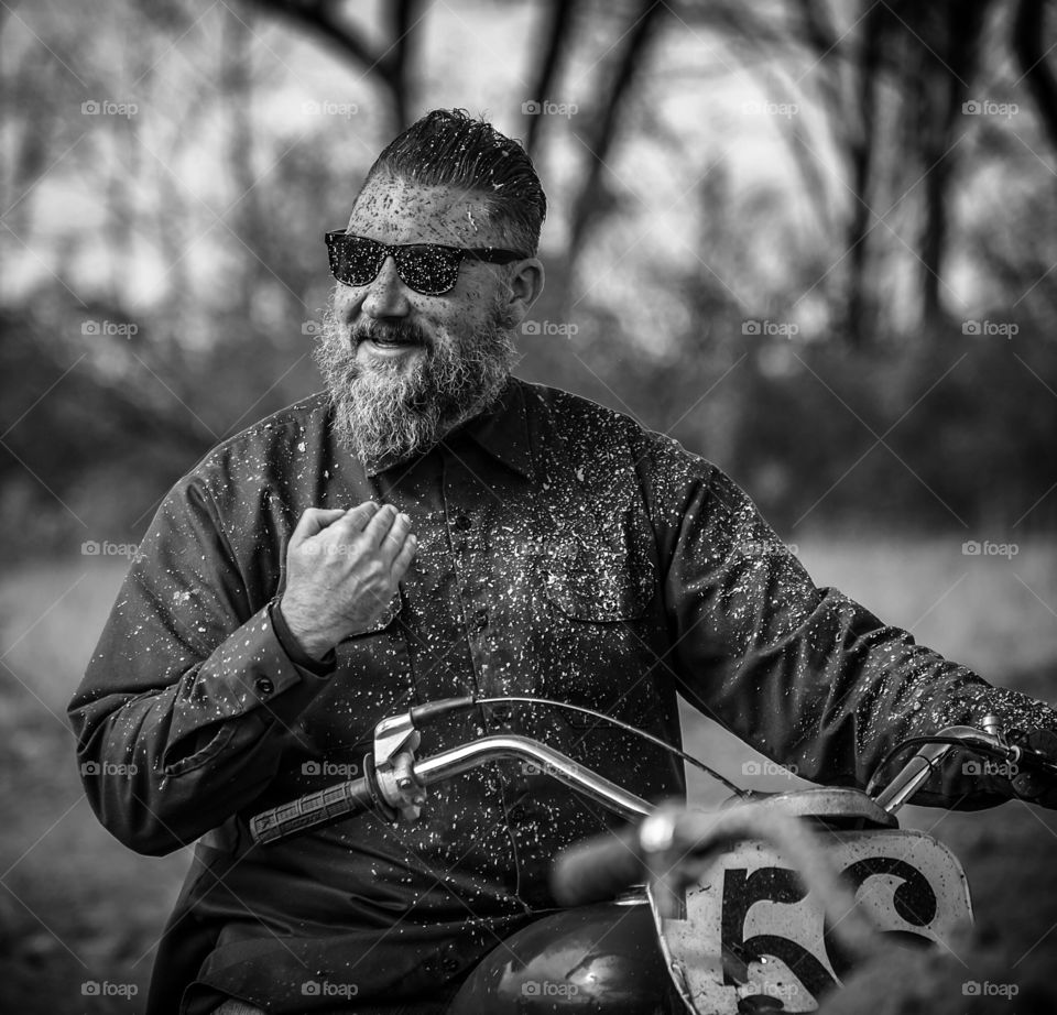 Beard dirt man sitting on motorbike