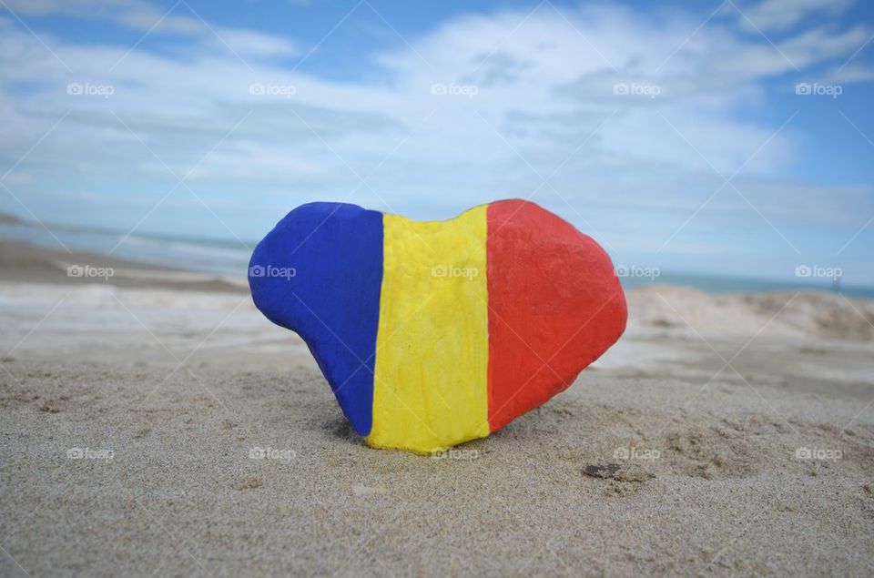 I love Romania, national flag on a stone heart