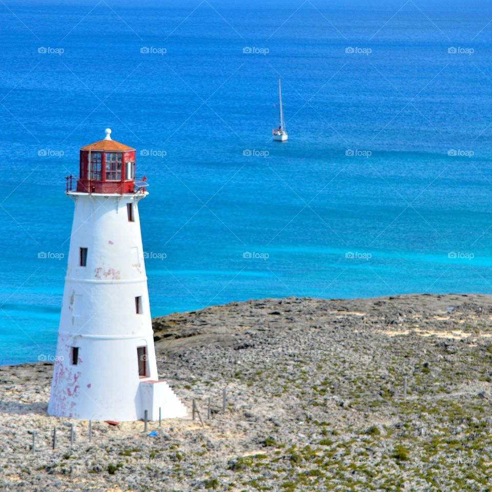 blue waters and white lighthouses