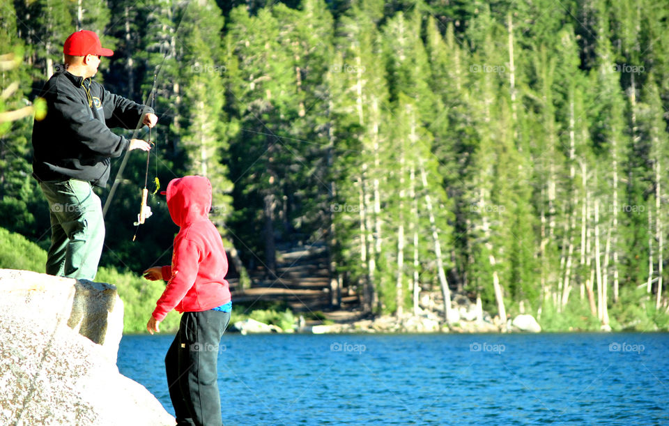 Father and son fishing at the lake