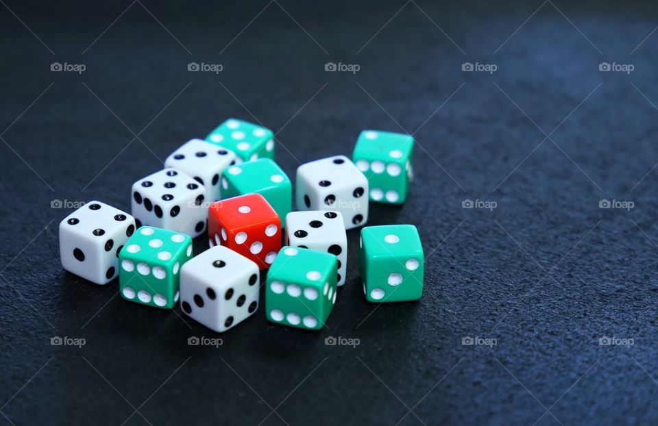 Handful of dice that are used at casinos for gambling