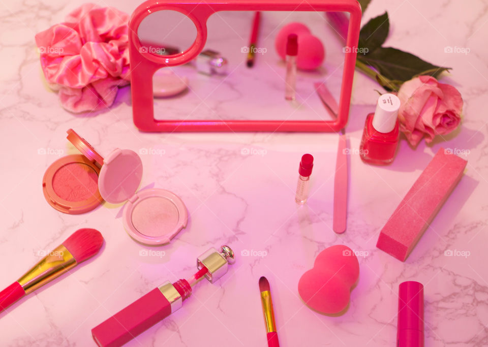 Pink Luster; Pink Gel Flash used to capture flat lay of numerous pink toiletries 