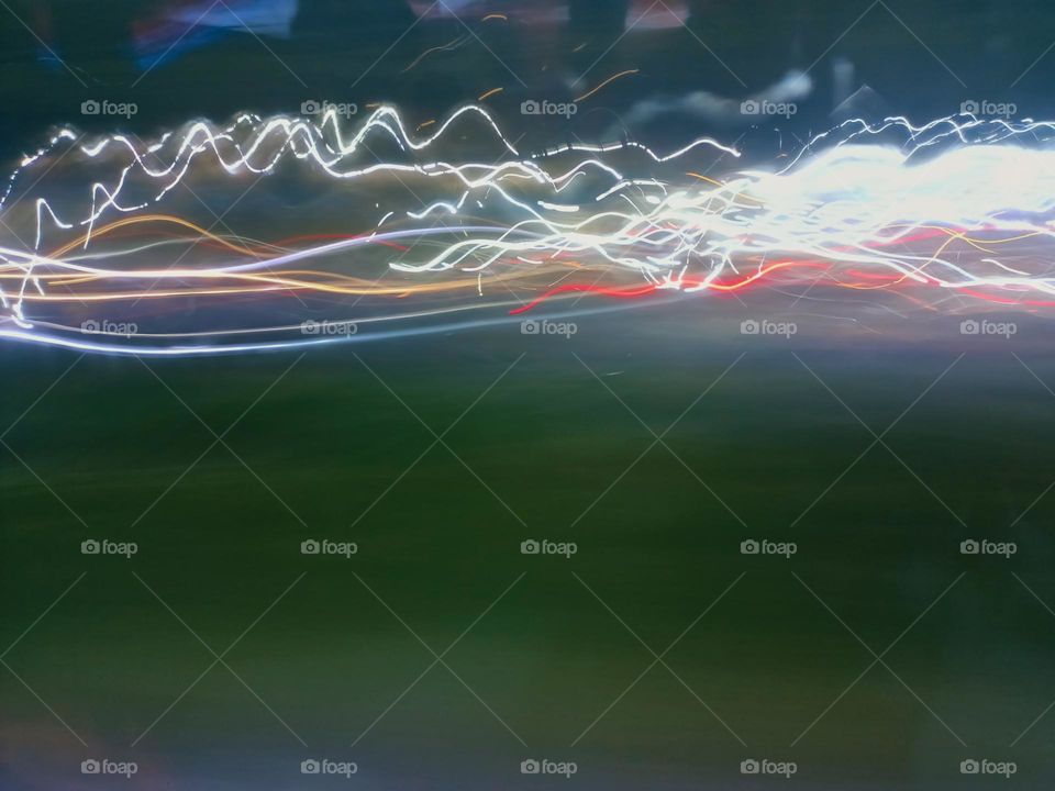 City night lights perspective blurred by high speed of the car. Abstract City night lights. Background and texture.