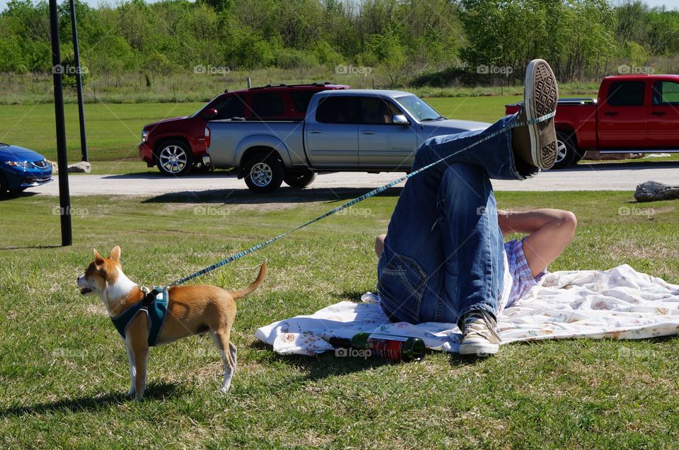 Relaxing with Fido. Holding leash with foot