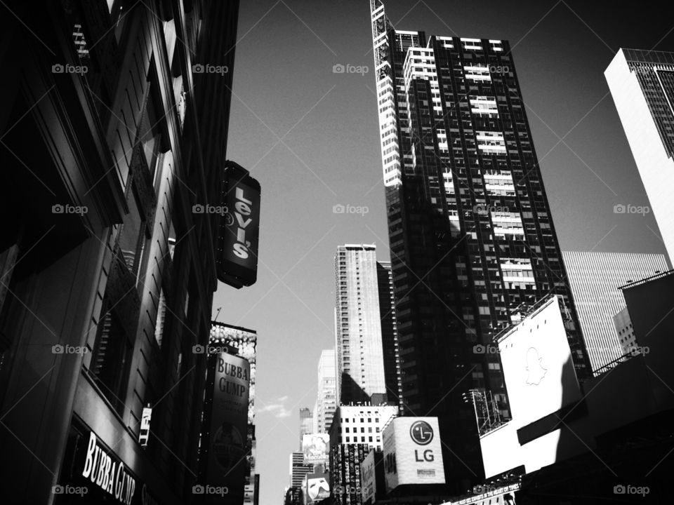 Sky rise NYC. Tall buildings, sunlight hitting the Windows...