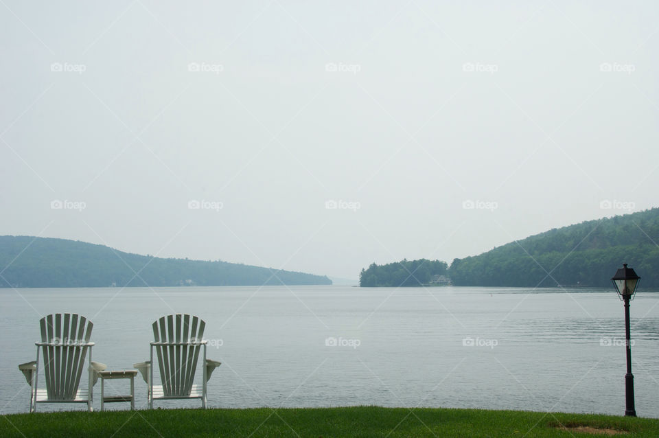 Adirondack chairs by the lake in Meredith