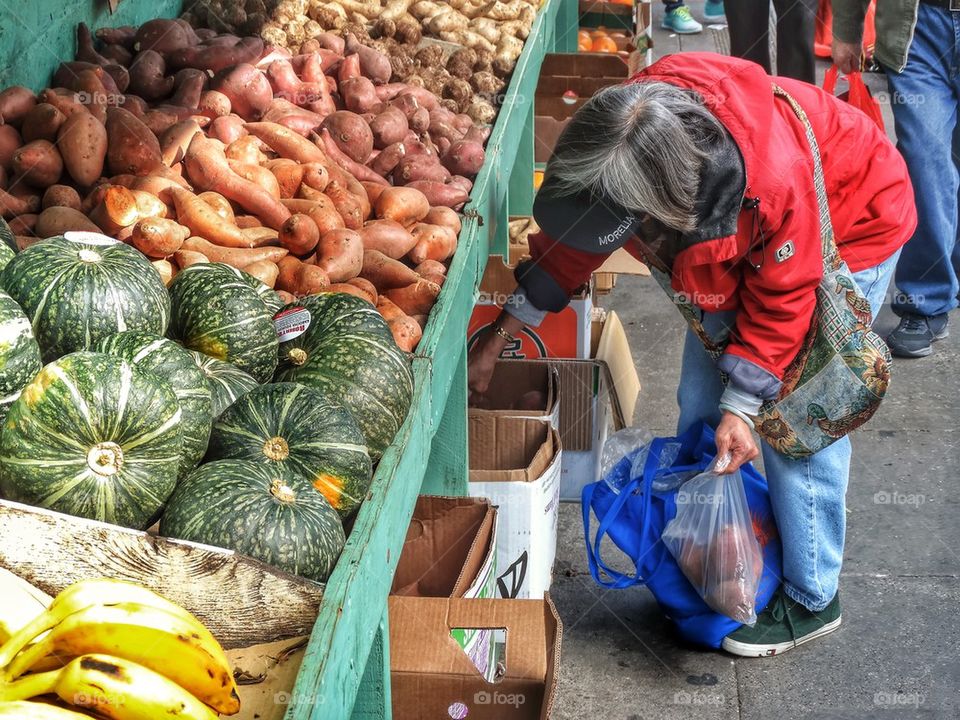 Vegetables On Display In Chinese Street Market. Shopping For Vegetables In A Chinese Street Market
