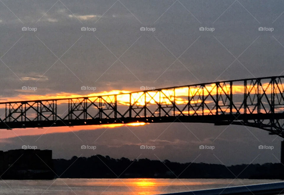 Sunrise through a bridge