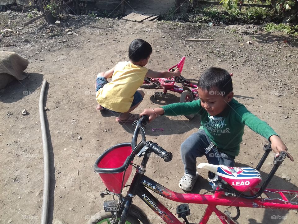boy adjusting bikes