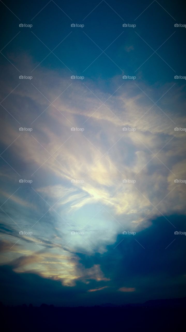 Bright Blue Intense Blue Skies
With  Captivating Colors 
Mix in with Illuminating 
The Sky to please my eyes
Appreciatiating the moment
To see, blessed to have been
Able to to go out at the right
Time was a blessing to me.
It is one thing at being out
At a right time to see a moment
In time , of a Beautiful sky 
That is right above me outside
And yet , how fortuate am I
To Capture that moment 
With a camera to share 
With others such a photo
And show others A Brilliant site.