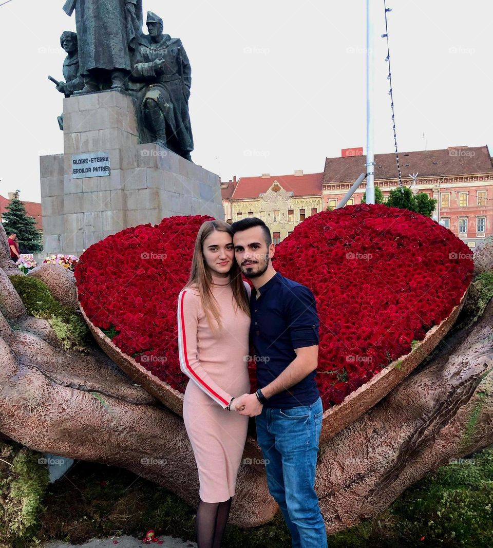 boy, girl and a huge magenta heart