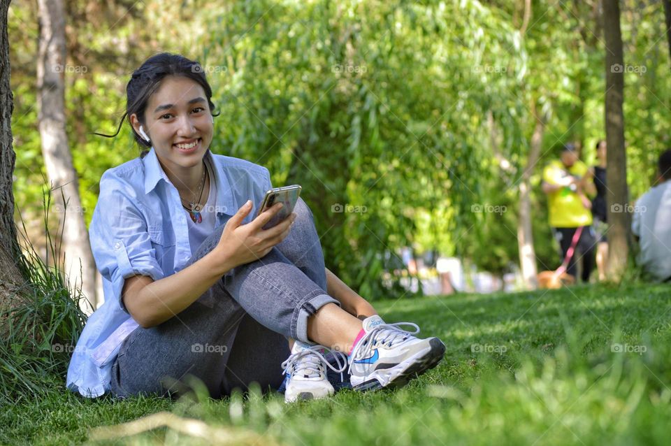 the girl smiles at the photographer who suddenly appeared at the camera