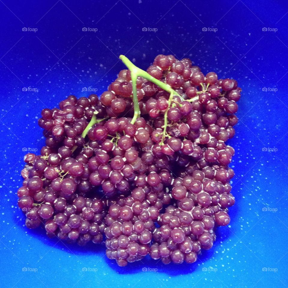 Champagne grapes in a bright blue bowl