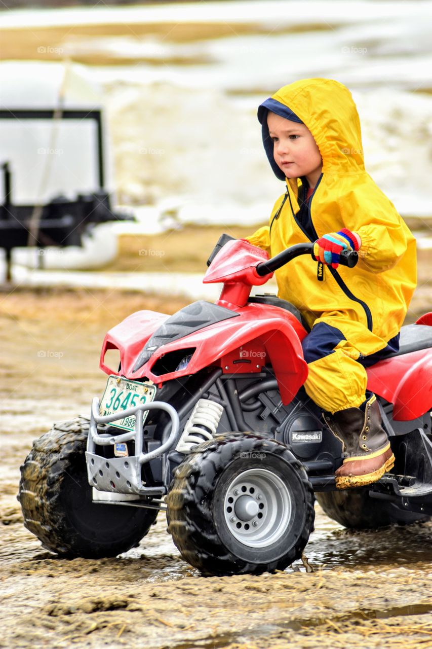 fourwheeling with rain gear on