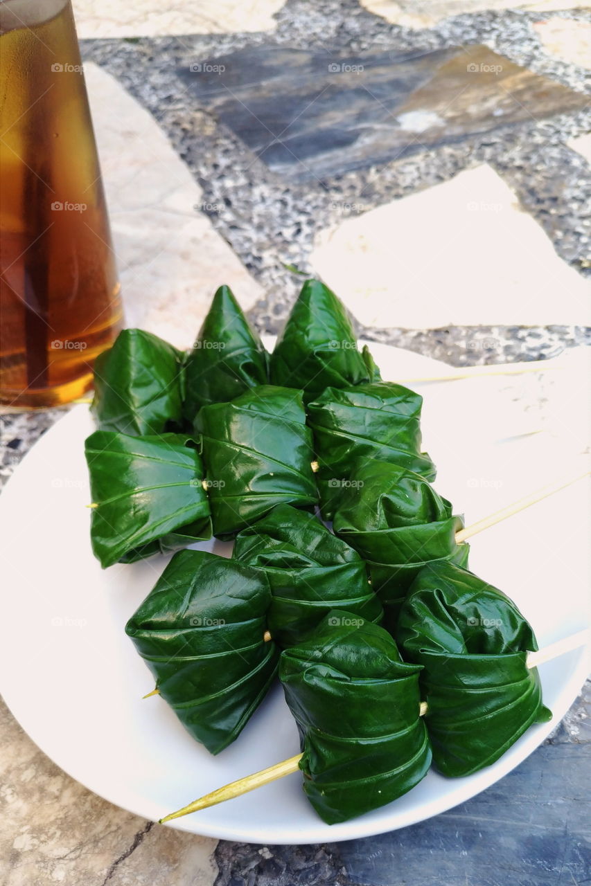 Miang Kham, a Northern Thailand snack eaten by Thais wrapped in wild piper leaves