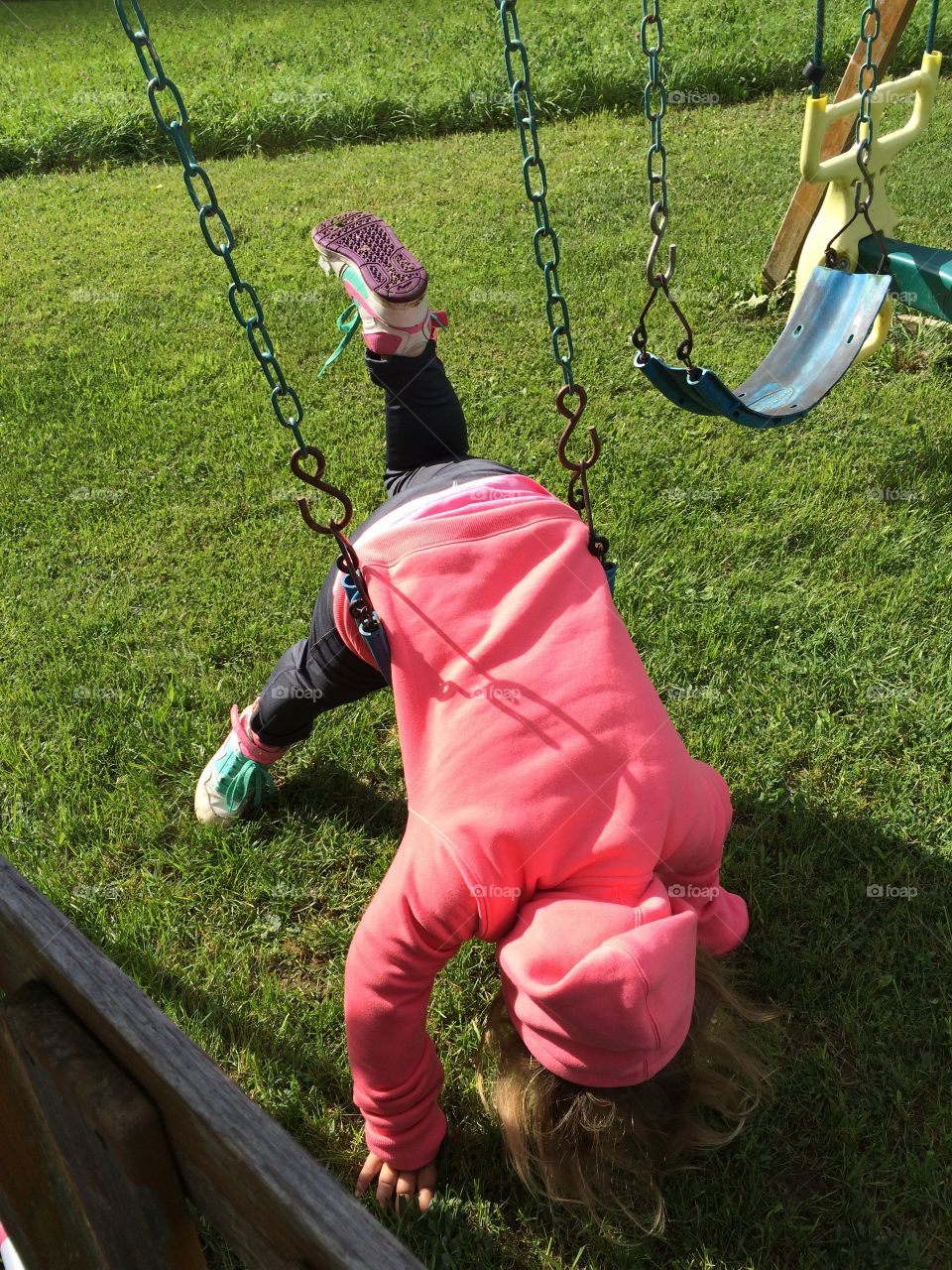 Girl playing with swing
