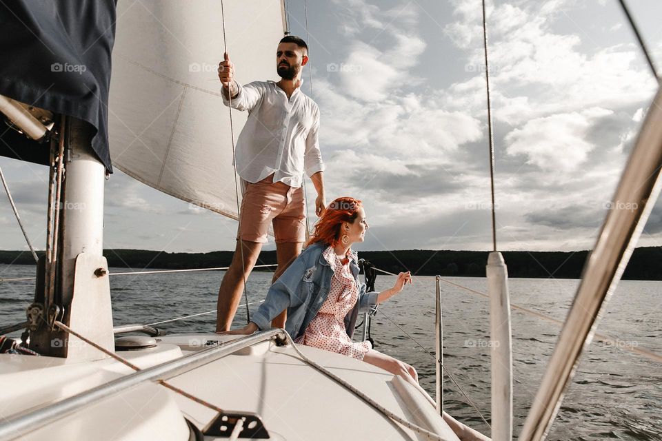 Girl and boy in yacht