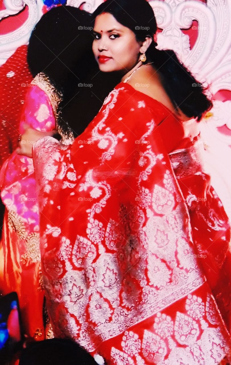 Young beautiful woman with benarasi Sari in a wedding ceremony.